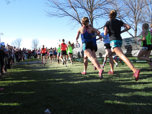 header of a girl wearing cross country spikes